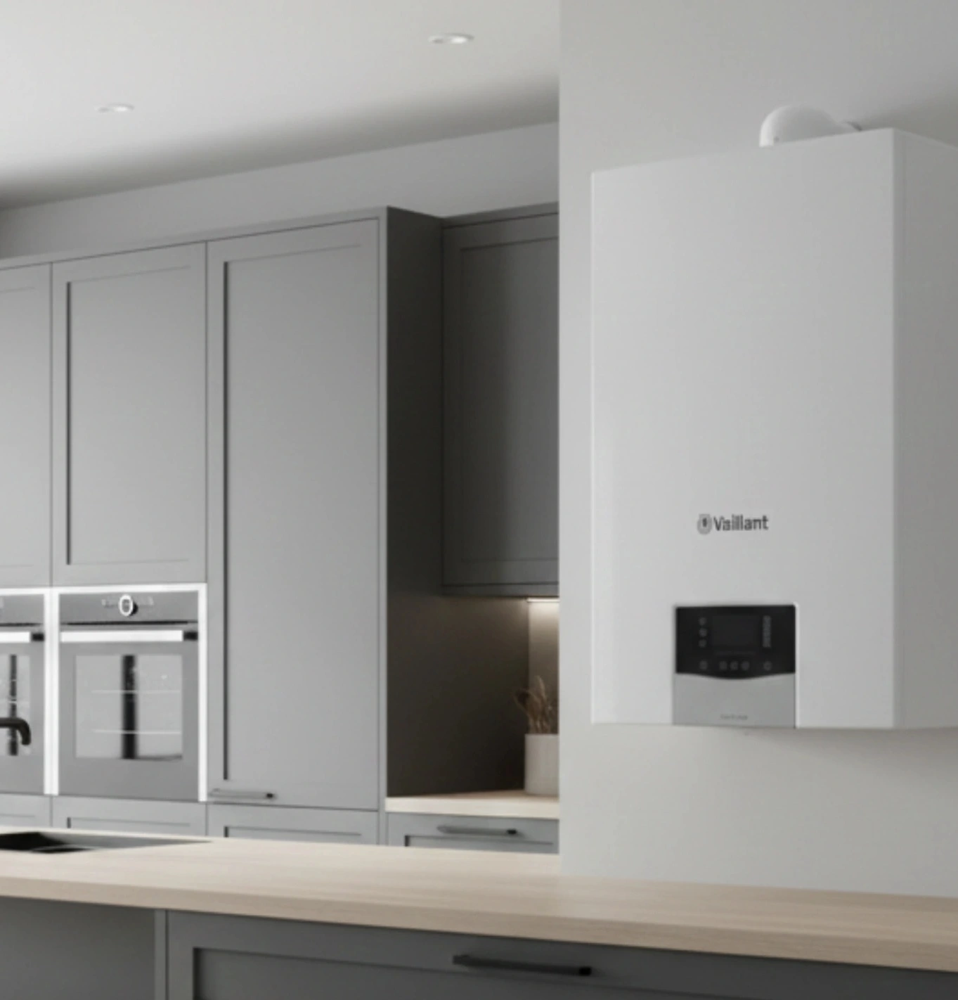 A modern white Vaillant gas boiler installed in a bright, contemporary kitchen